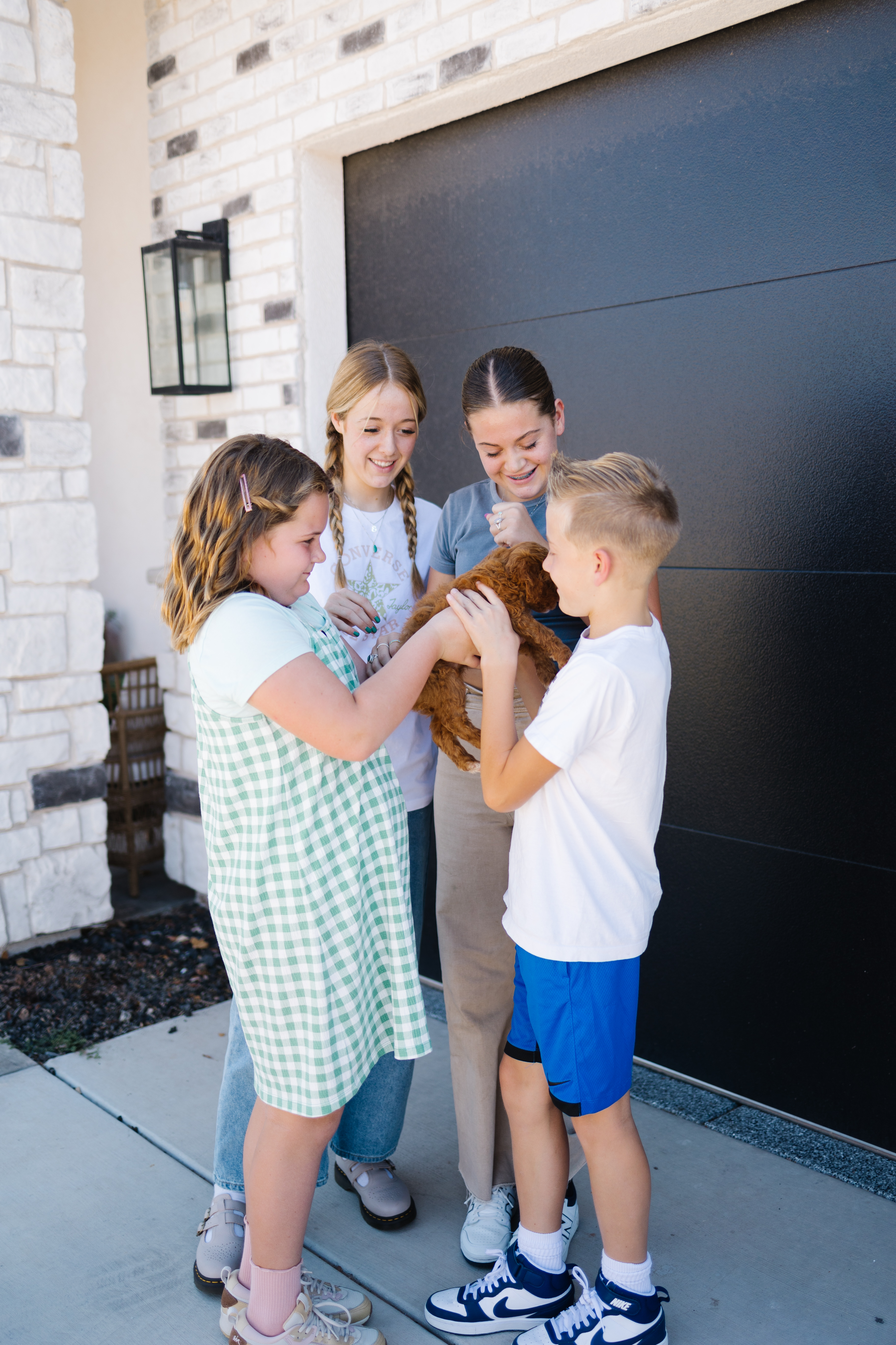 Guardian family meeting their new Goldendoodle puppy