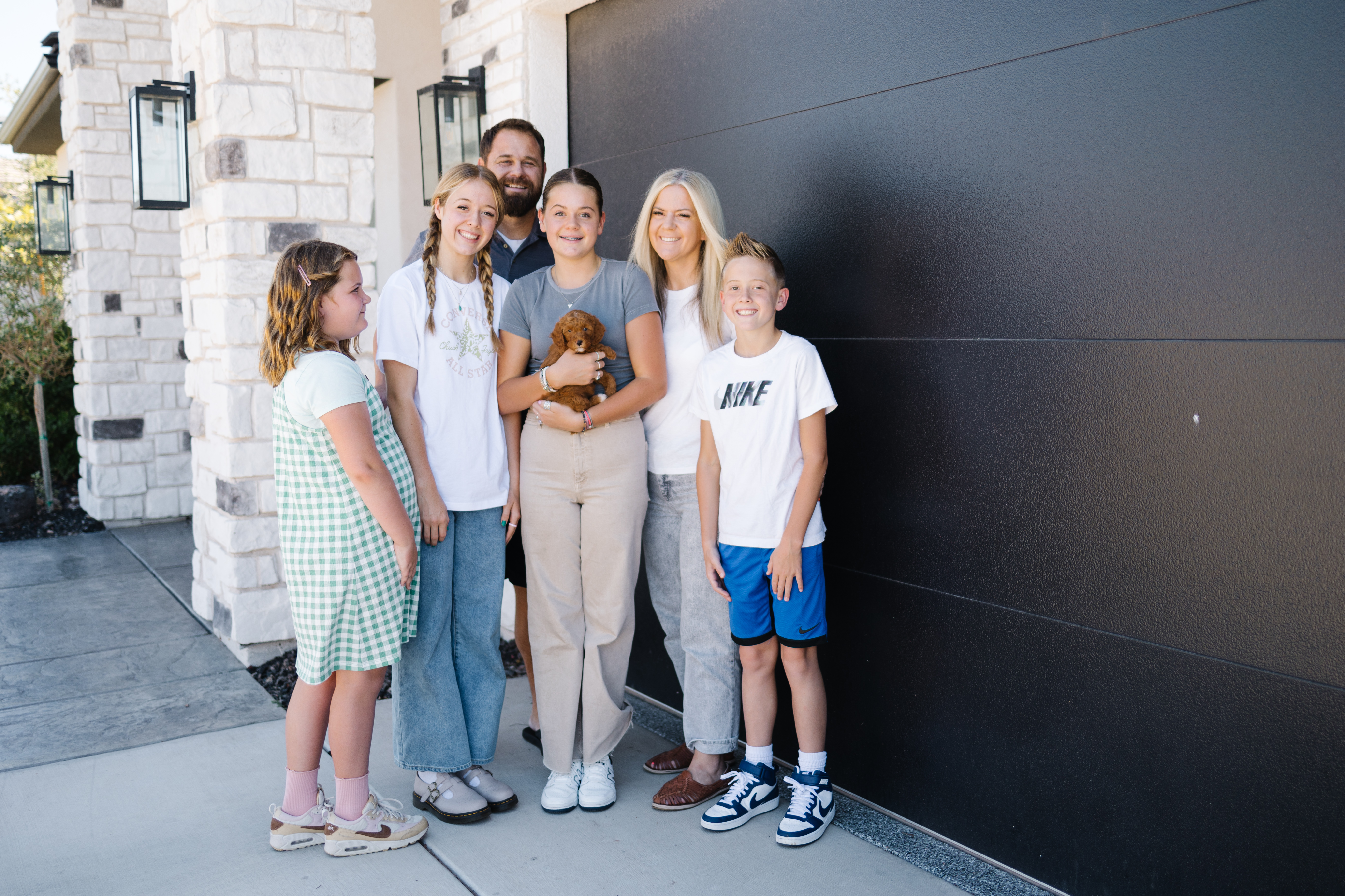 Judd family with their Goldendoodle puppy